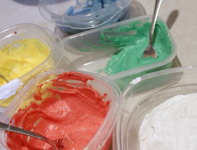 Sugar Cookie homemade frosting colored in containers 