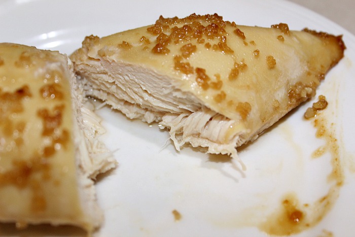 Weight Watchers Garlic Chicken served on a white plate cut open