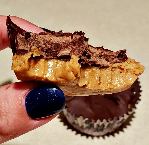 Homemade Peanut Butter Cups with a bite out of it with another one in the background