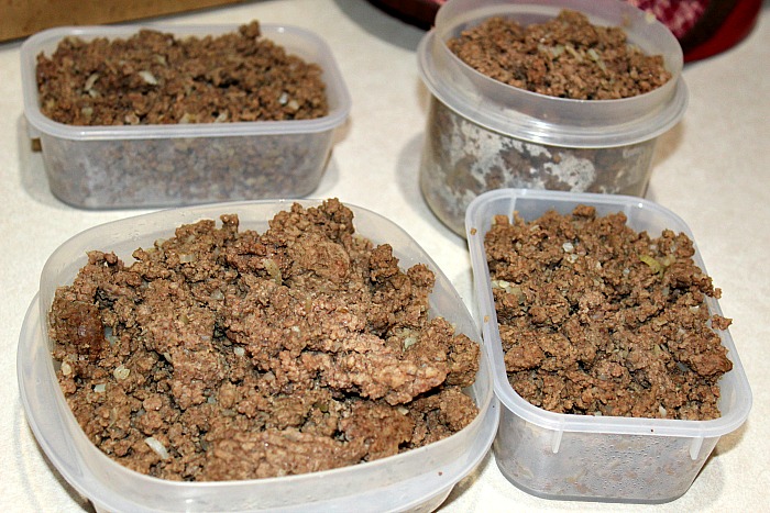 ground beef in containers on a container