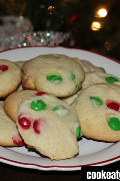 M&M Cake Mix Cookies on a plate with a tree in background