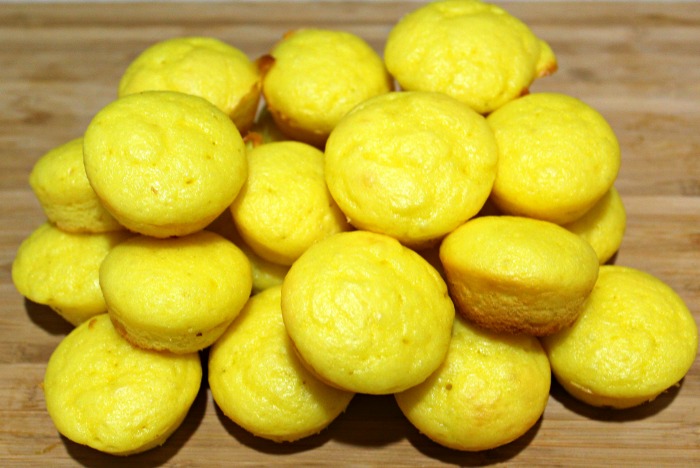 Lemon Weight Watchers Muffins piled on a cutting board 