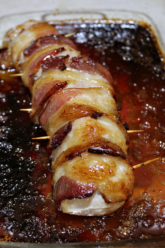 Cooked Bacon Wrapped Pork Tenderloin in casserole dish