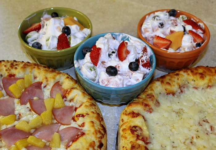 Bowls Of Fresh Fruit Salad With Frozen Pizzas 