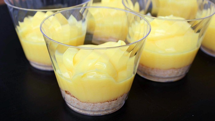 Cups with ground vanilla wafers topped with vanilla pudding 