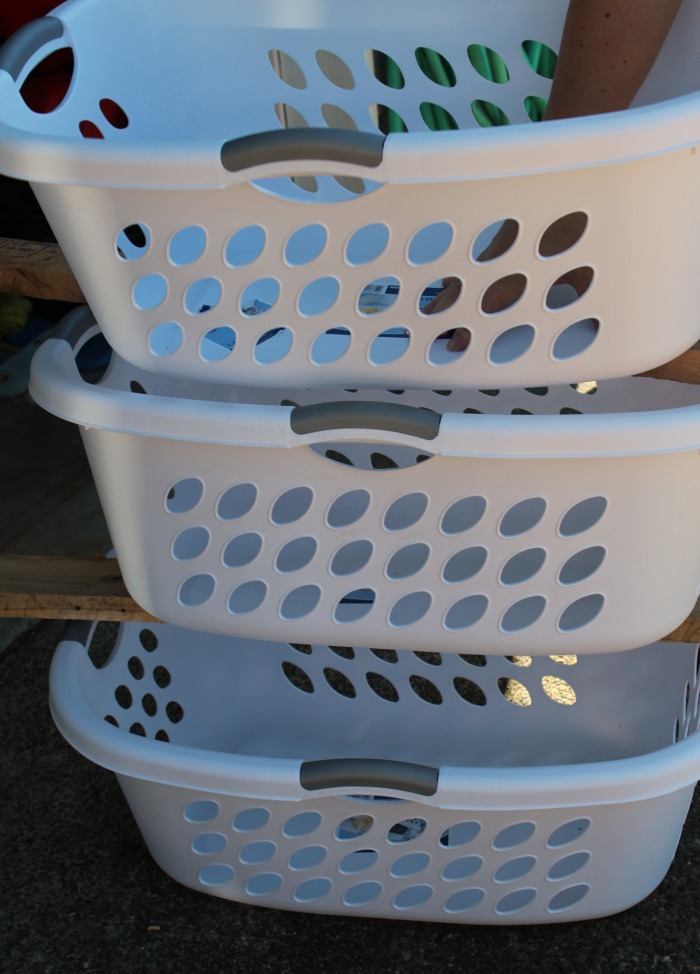 Hip laundry baskets spaced out for DIY Laundry Pallet Shelf