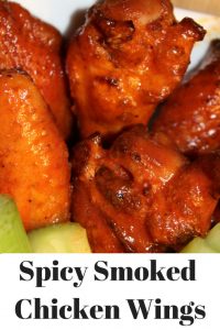 These Spicy Smoked Chicken Wings are perfect for tailgating! Season them and let them slow cook in the smoker for amazing flavor, top with sauce for a kick!