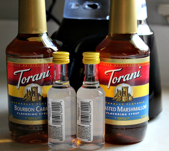 Torani Syrup bottles with two liquor shot bottles
