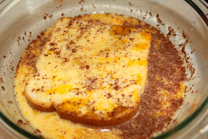 Bread dipped in egg and cinnamon for french toast