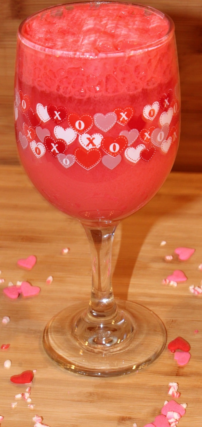 Strawberry Creamsicle in wine glass settling down 