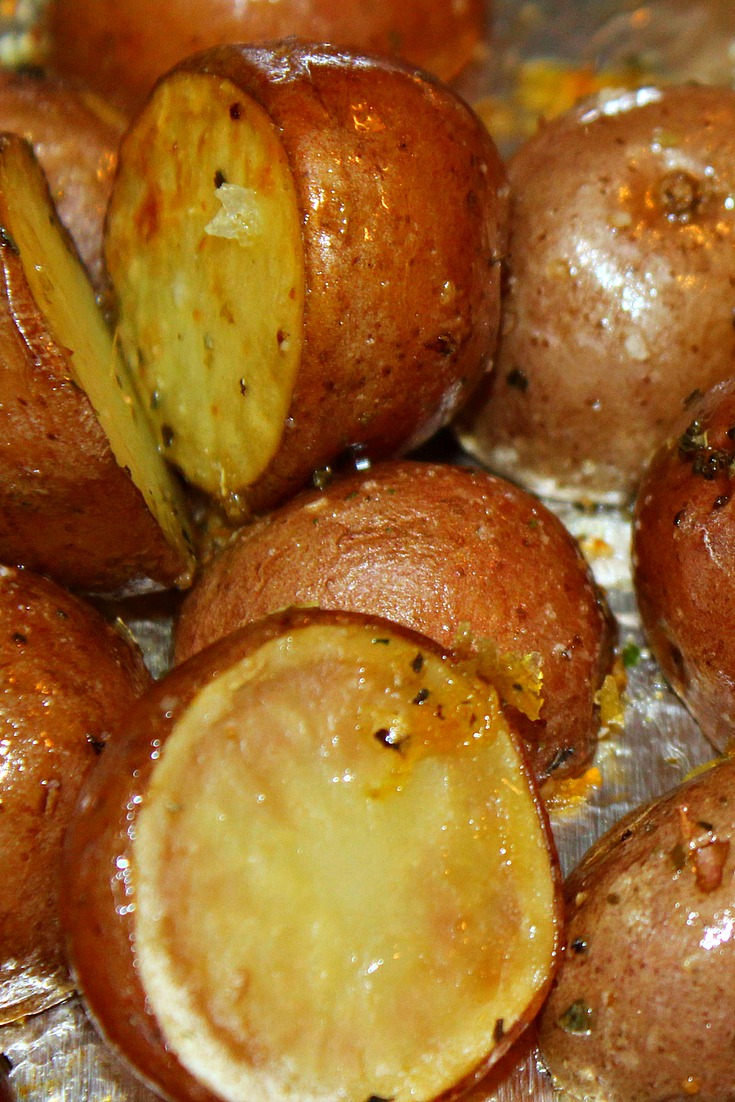Cooked Oven Roasted Baby Potatoes On Cookie sheet covered in tin foil