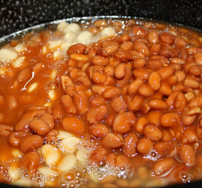 Crock Pot Loaded Baked Beans are perfect for any time of year. Just drop everything in the crock pot stir, perfect for picnics, tailgating, and potlucks 