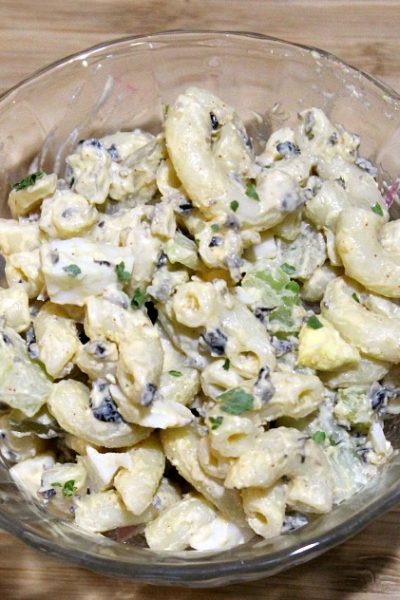 This Easy Deviled Egg Macaroni Salad is perfect to make up at home to take to a potluck or any family dinner. Plus it's frugal and cheaper than buying on on the way to the event, and very easy to customize!