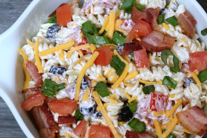 This Easy Bacon Ranch Pasta Salad is perfect to whip up for any potluck or bbq get together! Or it's the perfect frugal side to make up to have at home with a grilled dinner as well. Most the items in this are pantry items to stock up when they are on sale.