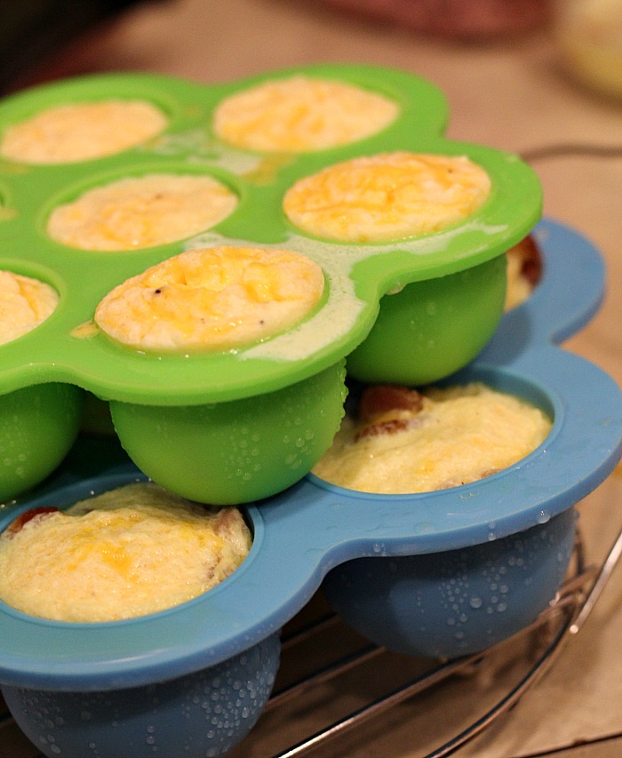 Cooked Instant Pot Egg Bites in molds on trivet on counter