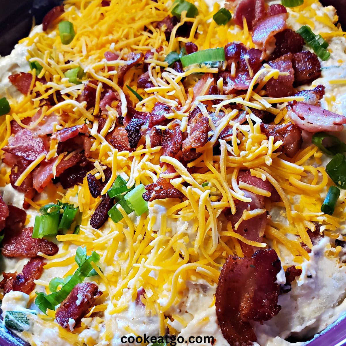Loaded Twice Baked Potato Salad Served in mixing bowl