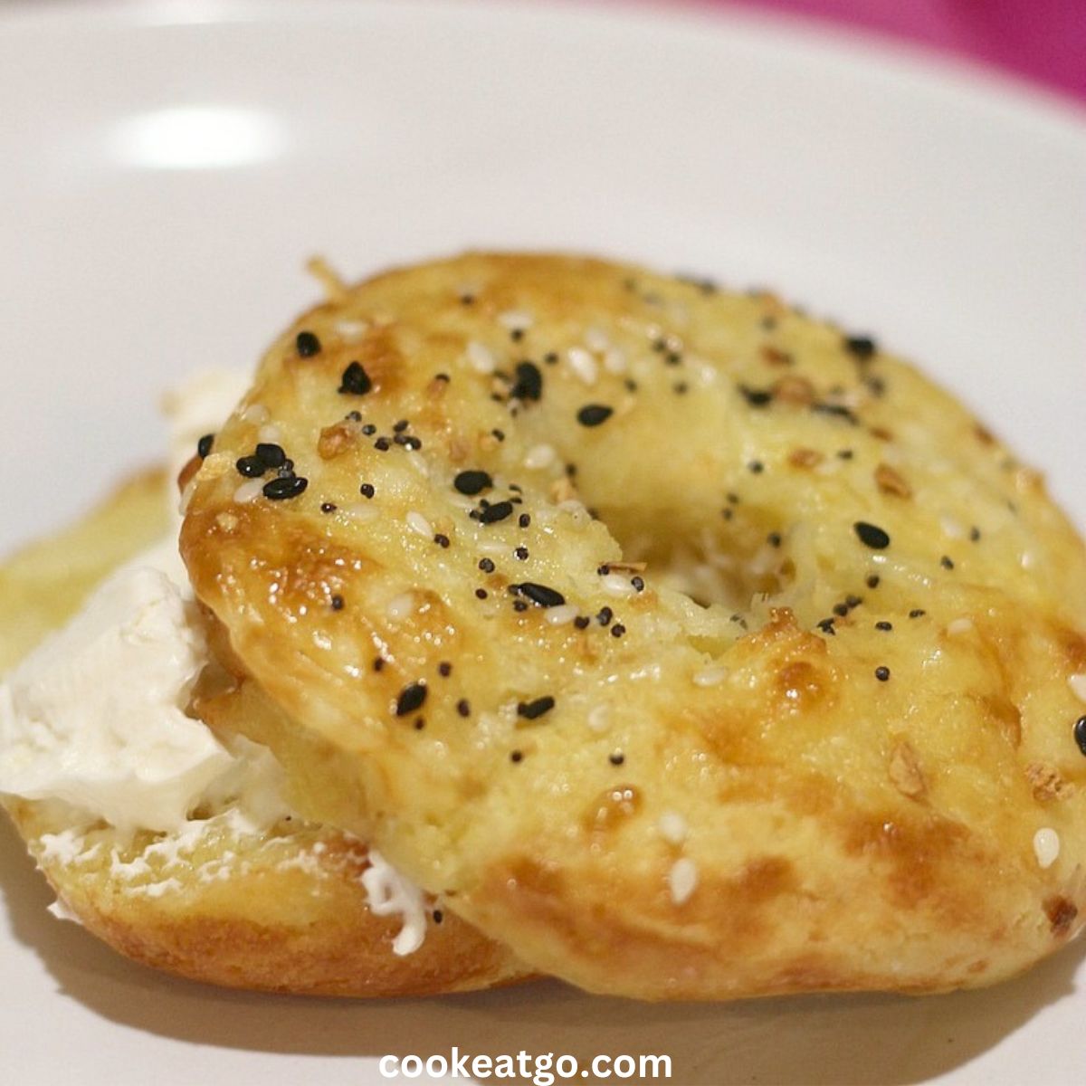 Low Carb Bagel With Cream cheese on a white plate
