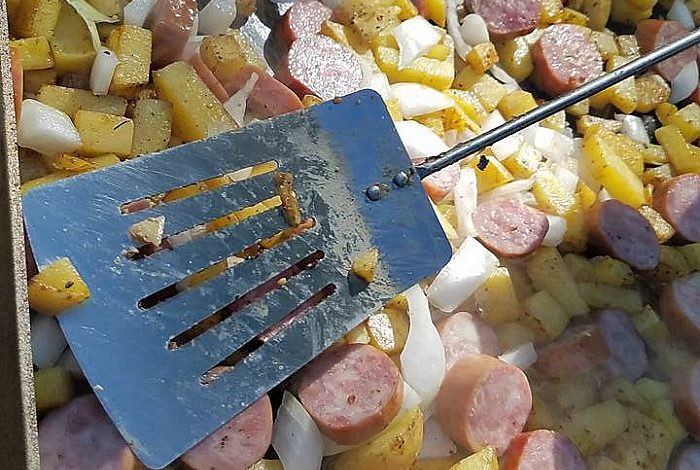 This Camping Griddle Breakfast Skillet is perfect to make while camping or even at home! Easy to make with potatoes, eggs, onions, bacon, and cheese!