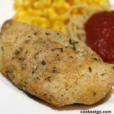 Weight Watchers chicken parmesan served with pasta and kernel corn