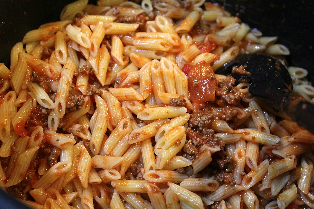 This Easy Baked Ziti Recipe is a perfect weeknight dinner! Or use leftover spaghetti with cheese as well! Easy dinner with meat, cheese, sauce, and pasta!   Easy Baked Ziti Recipe Ingredients: 1 Box of Penne Pasta Pasta Sauce 8 Oz Mozzarella cheese 1 lb of ground meat **I have done this with almost any type of pasta, the mini penne is one of the kids favorites pasta for ziti** Easy Baked Ziti Recipe Directions: Preheat your oven to 350 degrees Brown your meat, I normally pull out a container of precooked ground beef and just reheat it  (Be sure to check out our post - srcset=