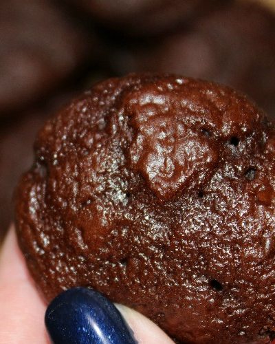 Chocolate Muffin Being held in fingers