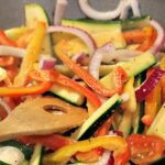 This Vegetable Stir Fry Recipe is easy to whip up in a wok or pan! Make perfect crisp vegetables as a side or add in pasta and meat to make a meal!