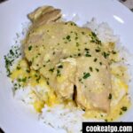 4 ingredient crockpot ranch chicken served on a bed of white rice on a white plate