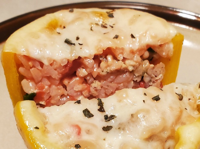 This Italian Stuffed Peppers Recipe is the perfect healthy dinner to make! Use your favorite spices with cheese, chicken, and rice to stuff make these.