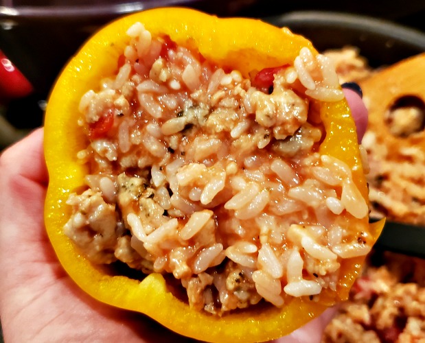 This Italian Stuffed Peppers Recipe is the perfect healthy dinner to make! Use your favorite spices with cheese, chicken, and rice to stuff make these.
