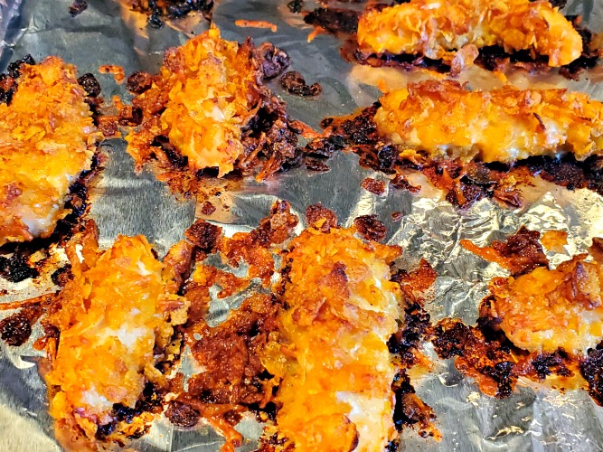 Baked Cornflake Chicken Tenders On Foil On Cookie Sheet  