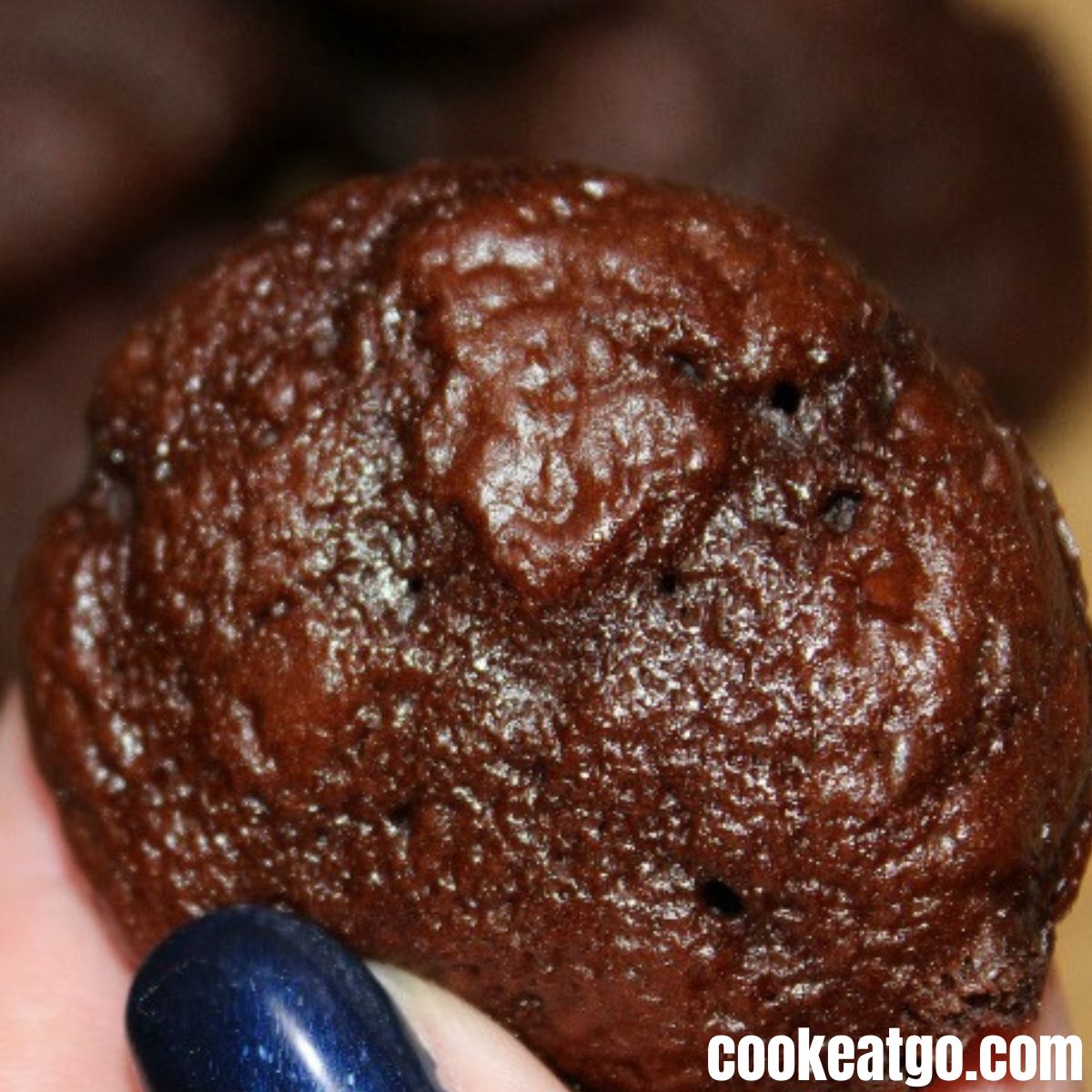Three ingredient chocolate weight watchers muffin baked in a hand