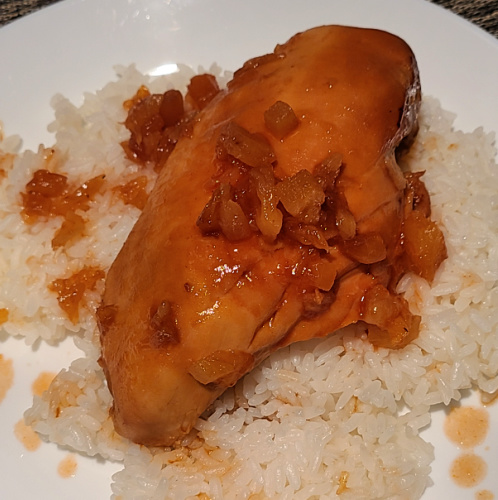 3 Ingredient Slow Cooker Hawaiian Chicken served over white rice on a white plate. 