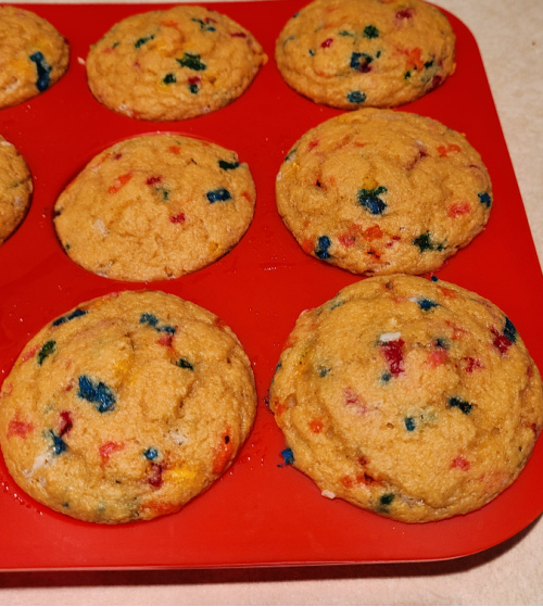 Baked Sprinkle WW Kodiak Muffins in a red silicone pan
