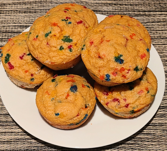 Sprinkle WW Kodiak Muffins stacked on a white plate. 