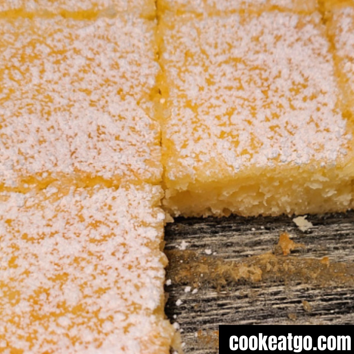 2 Ingredient Lemon Bars baked with pieces missing out of pan 