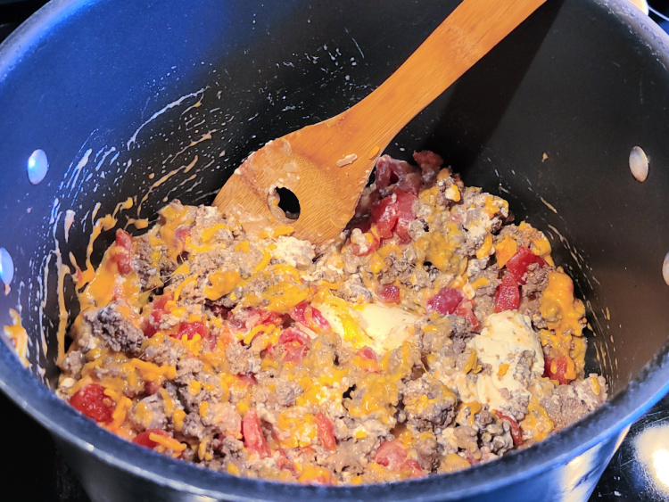 This Crockpot Cheeseburger Bacon Dip Recipe is perfect for tailgating or get-togethers! Use cheeses, beef, and bacon to make this dip! After melting on the stovetop cook on low for just two hours in the crockpot! Serve with chips or for full keto serve with pork rinds.