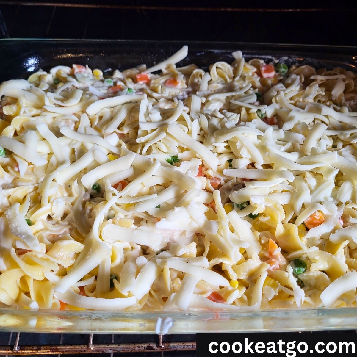 Turkey Noodle Casserole in oven topped with mozzarella cheese