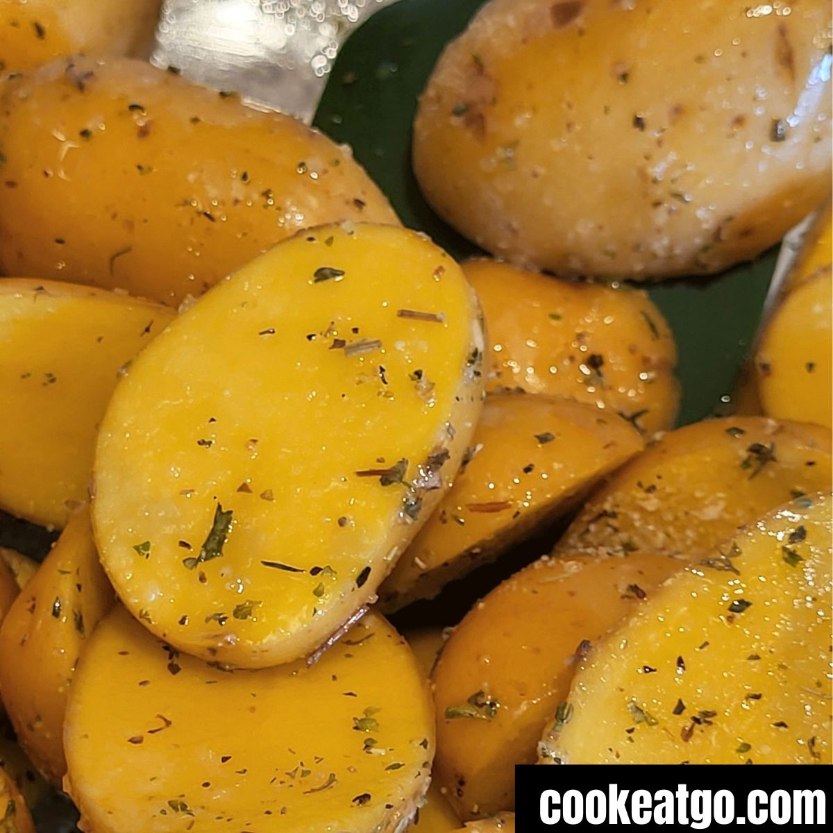Baby potatoes sliced and seasoned to be air fryred