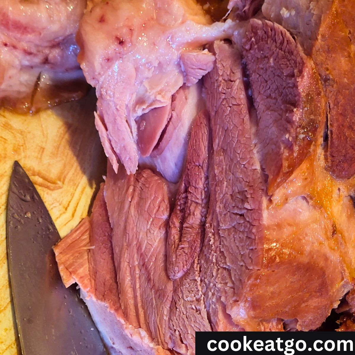Dr. Pepper Ham removed from crockpot sliced open on a platter