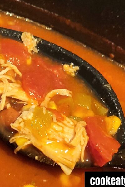 Slow cooker turkey taco soup on a spoon in a crockpot