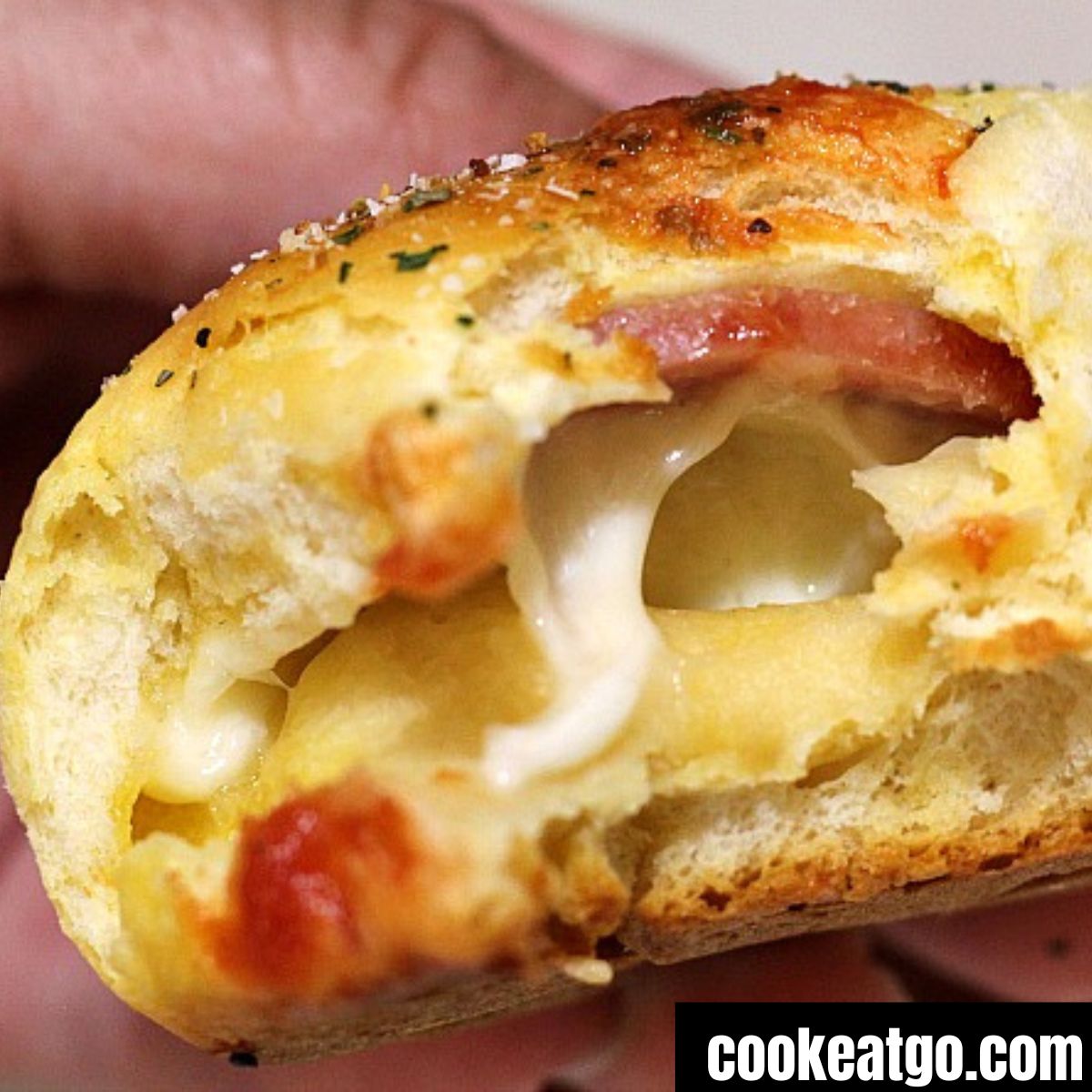 Inside of a Cheesy Pizza Biscuit made from pillsbury biscuit dough