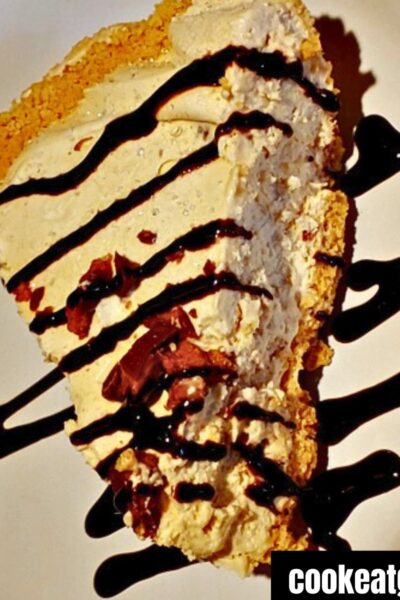 Peanut Butter Pie Served on a plate drizzled with chocolate syrup