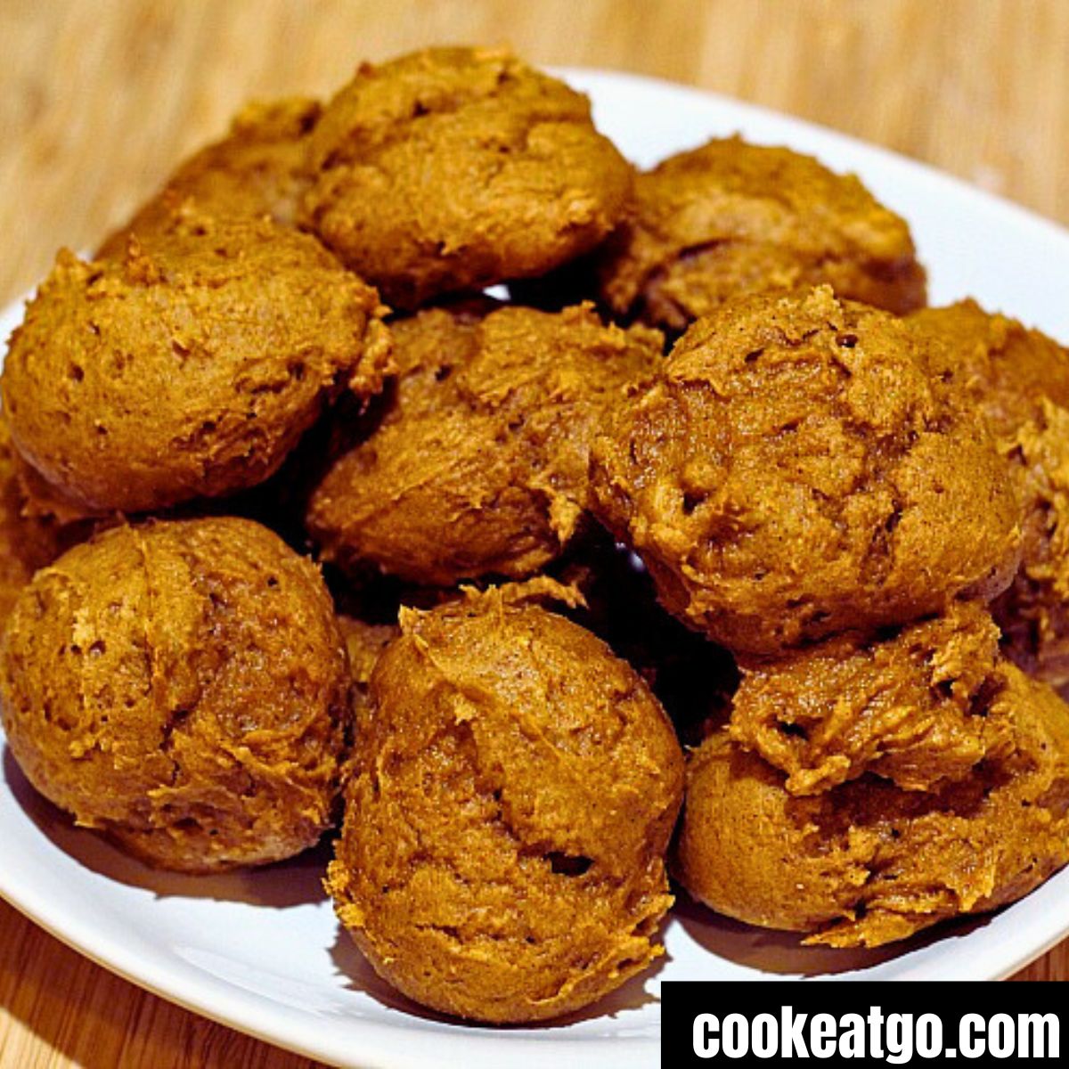 A pile of 2 ingredient pumpkin cookies on a white plate