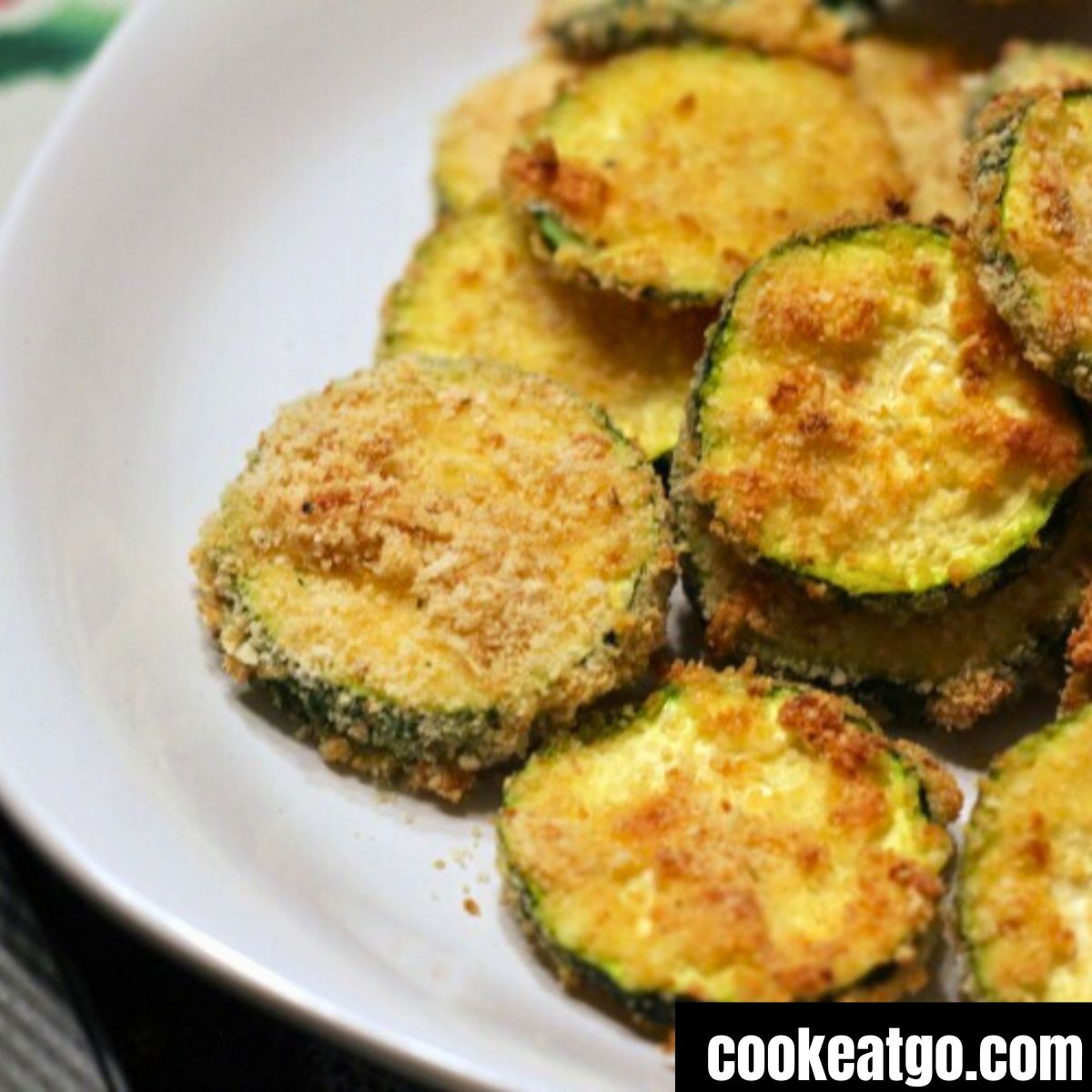 Air Fryer Zucchini Chips served on a white plate