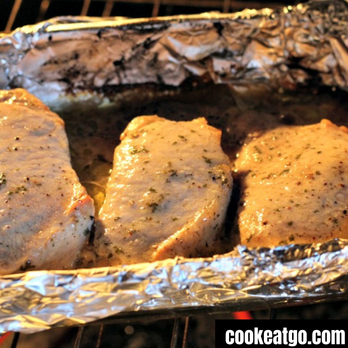 Oven Roasted Ranch Pork Chops in pan on foil baking