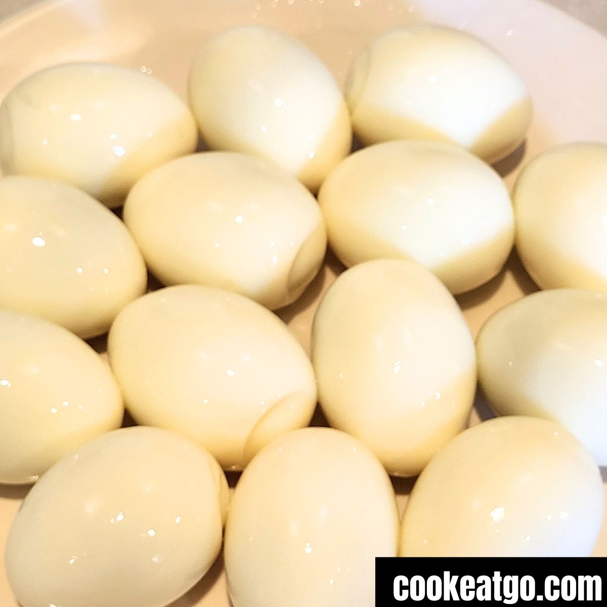 peeled hard boiled eggs on white plate