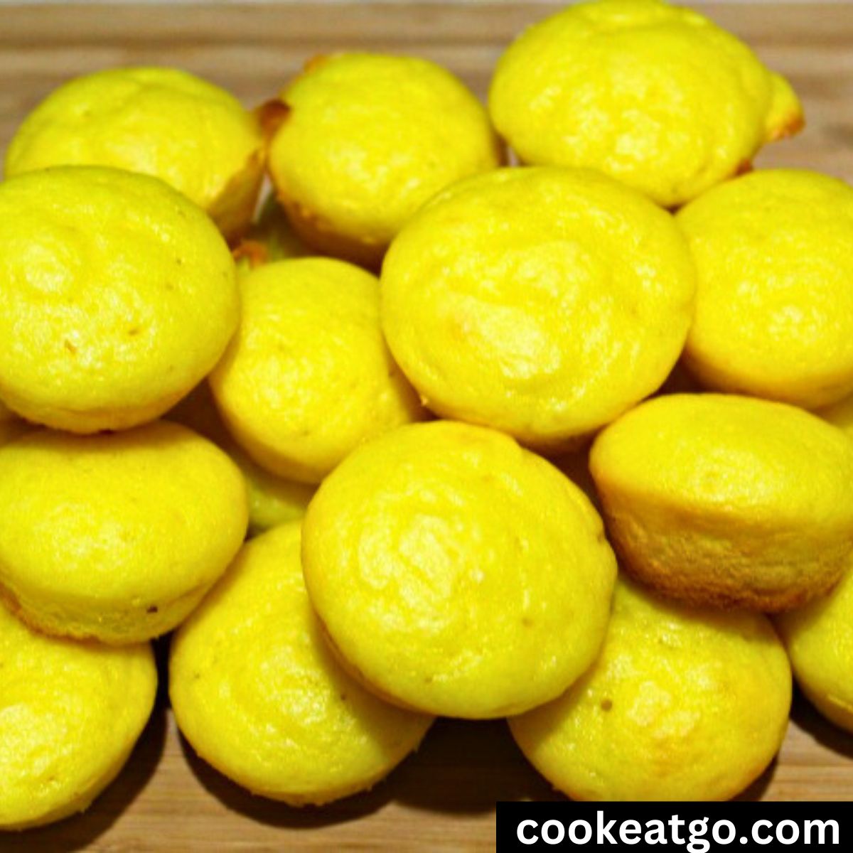 Weight Watchers Lemon Muffins piled on a cutting board