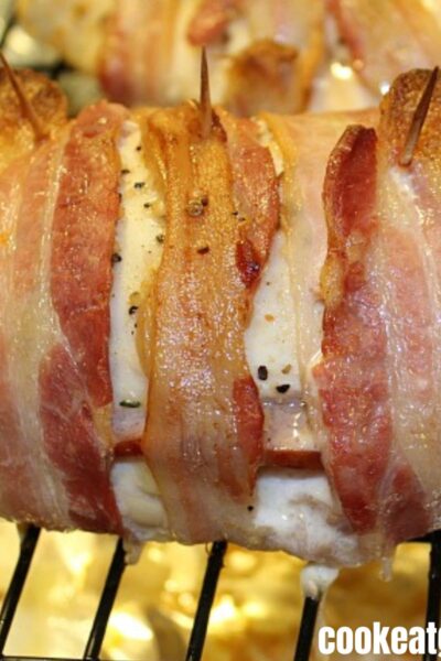 Cooked Bacon-Wrapped Chicken Cordon Bleu on backing rack