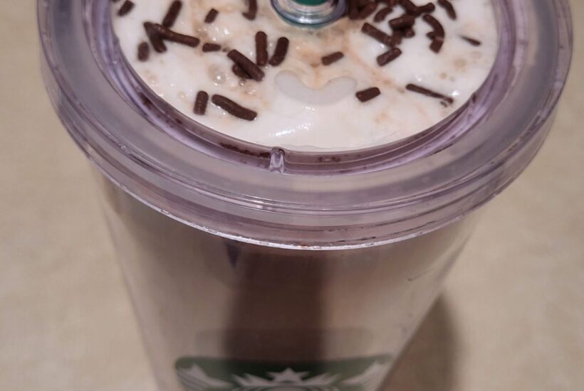 Starbucks cup with skinny peppermint mocha latte served with whipped toping and chocolate sprinkles