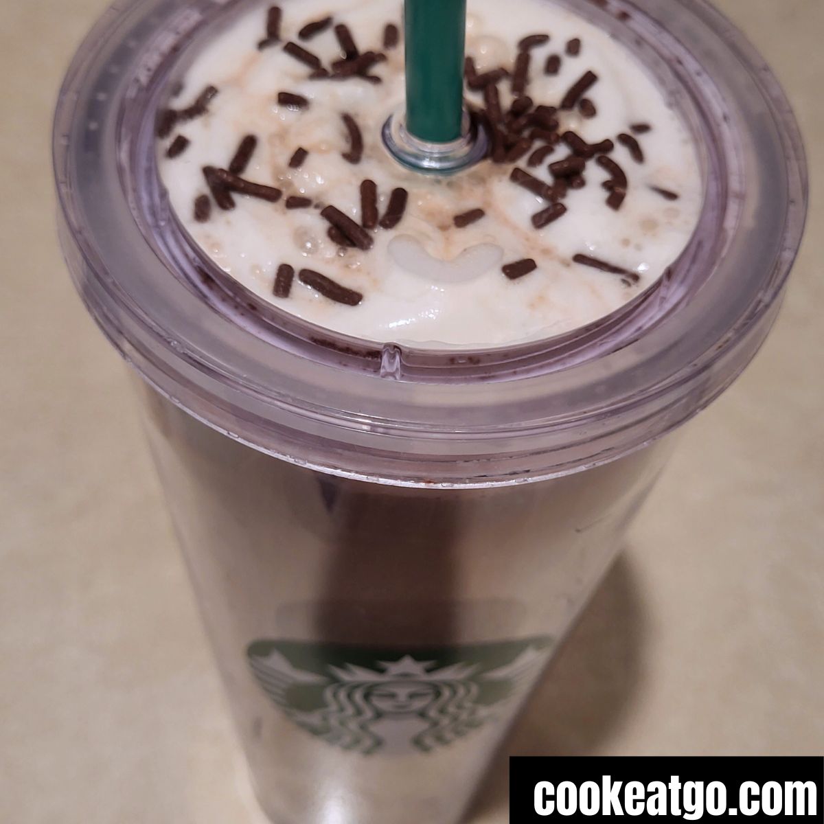 Starbucks cup with skinny peppermint mocha latte served with whipped toping and chocolate sprinkles
